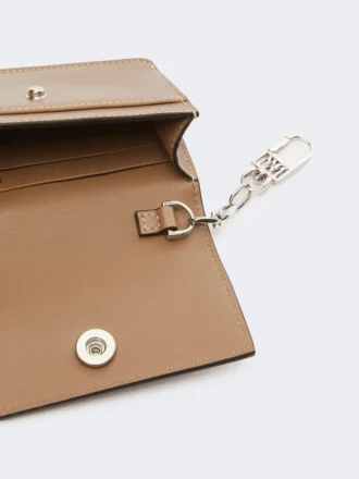 Leather purse, mud