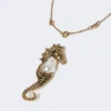 Metallic necklace with pin pendant, gold Metallic necklace with pin pendant, gold