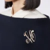 Monogram brooch with rhinestones, ivory