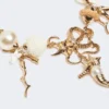 "abissi" metal and raffia choker necklace, gold