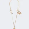 Set with charms and crystals, gold