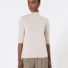 Stockinette-stitched wool polo-neck sweater, powder Stockinette-stitched wool polo-neck sweater, powder